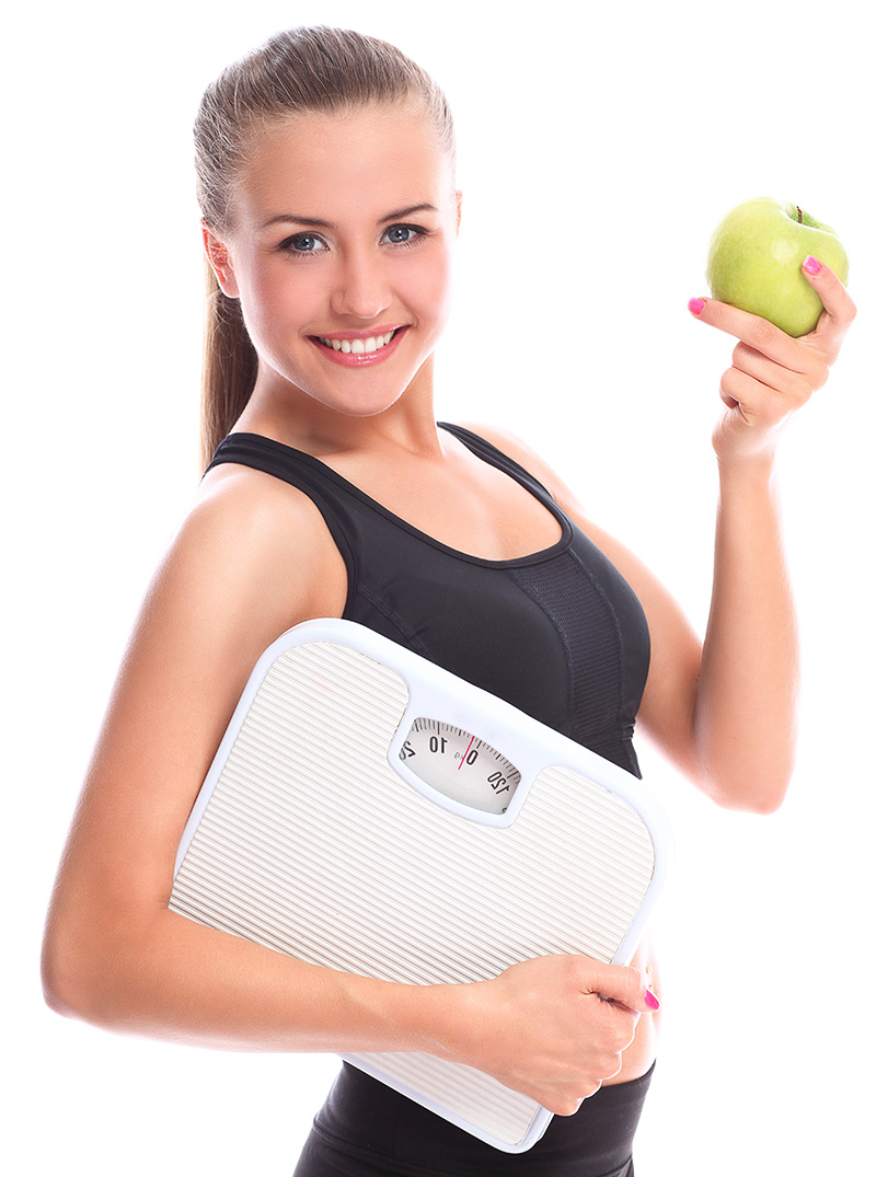 woman holding scale and apple weight loss